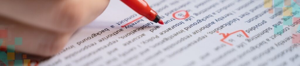 Person proof-reading and editing text, circling errors with a red marker.