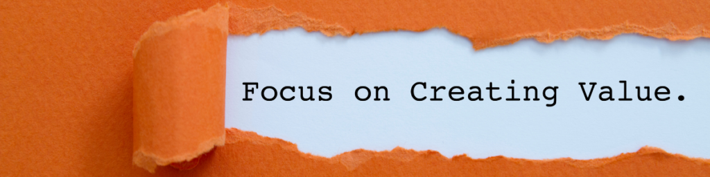 A piece of paper ripped to reveal the sentence "focus on creating value."