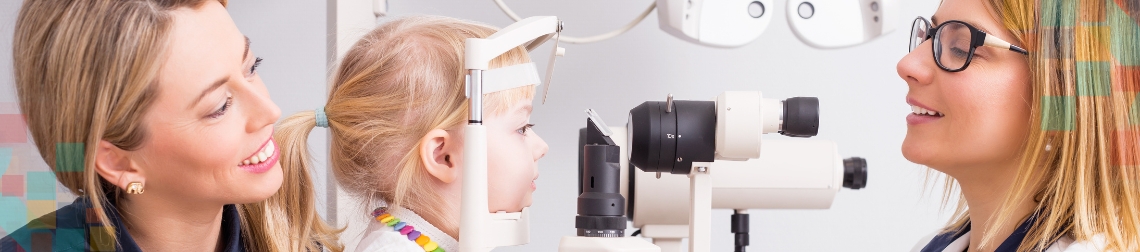 Child getting an eye exam from a kind optometrist