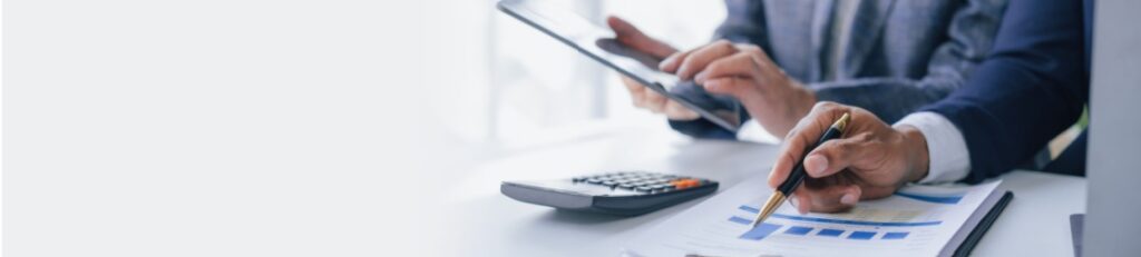 A person calculating the valuation of their optometry practice when planning to sell their business.