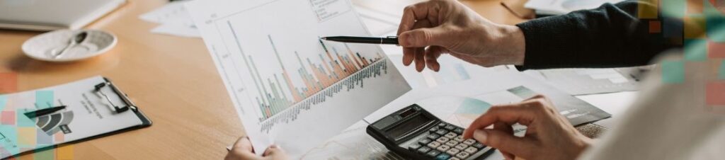 Someone looking at a graph and doing calculations.