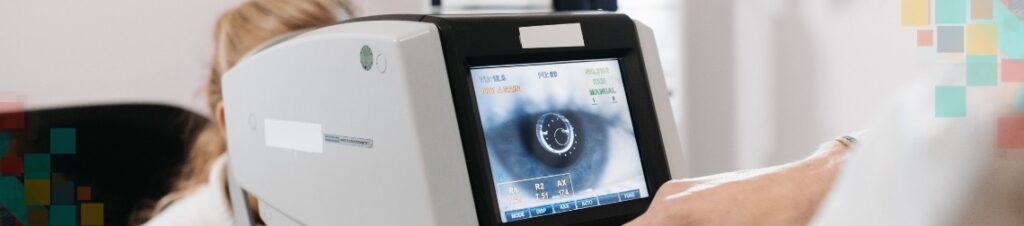 A device showing a close up image of an eye during an exam 